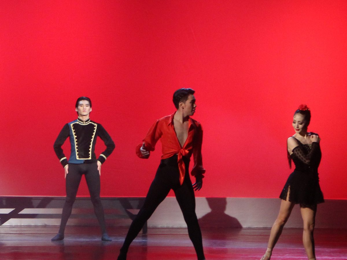 Nomadic Ballet dancers in Carmen, on a red-lit stage