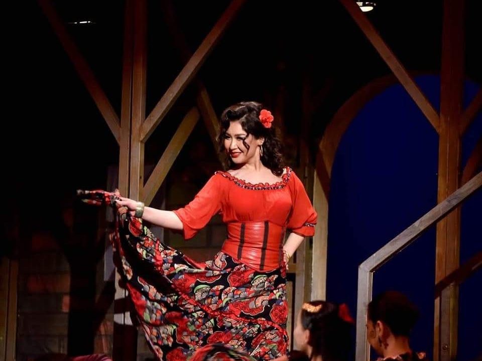 Chuluunchimeg Togtokhbayar in costume as Carmen, on stage